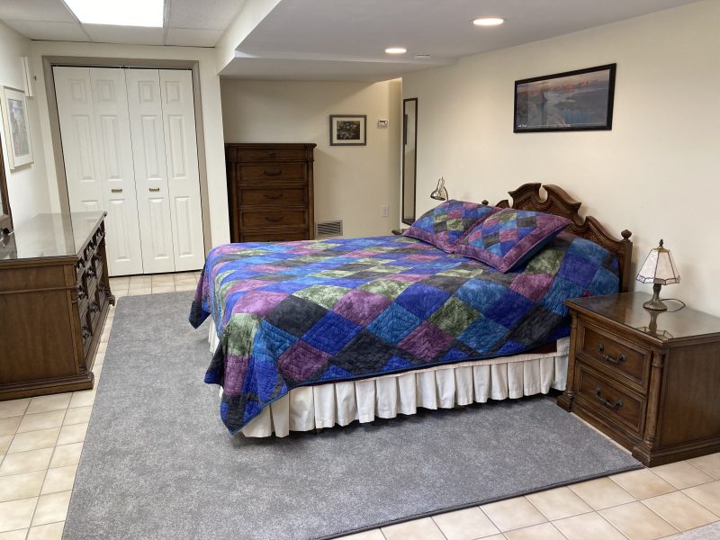 Large furnished room in bright walkout basement of single family home close to public transportation  and 3 miles from NIH